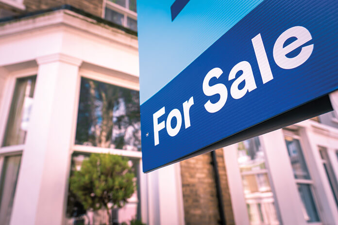 For sale sign outside a house