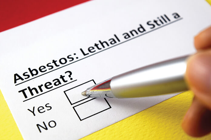 Someone answering a questionnaire about asbestos