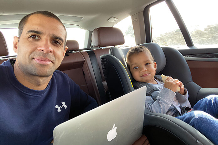 Harvey from Growth Properties sat in his car with his laptop