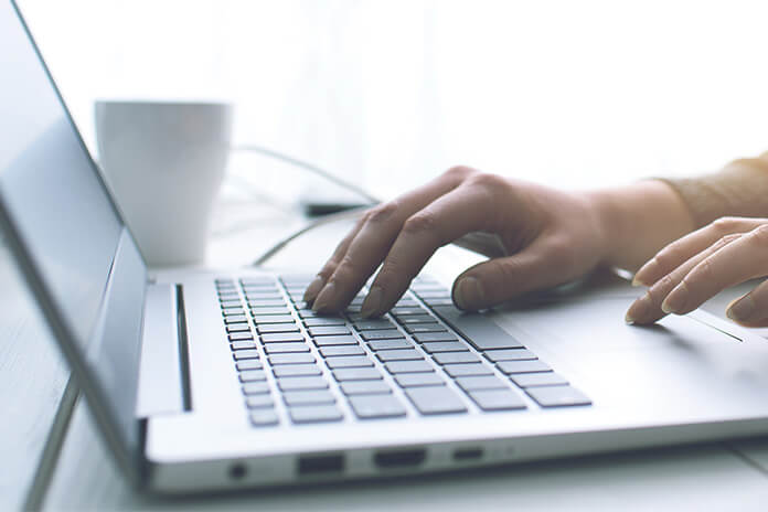 A woman working on a laptop