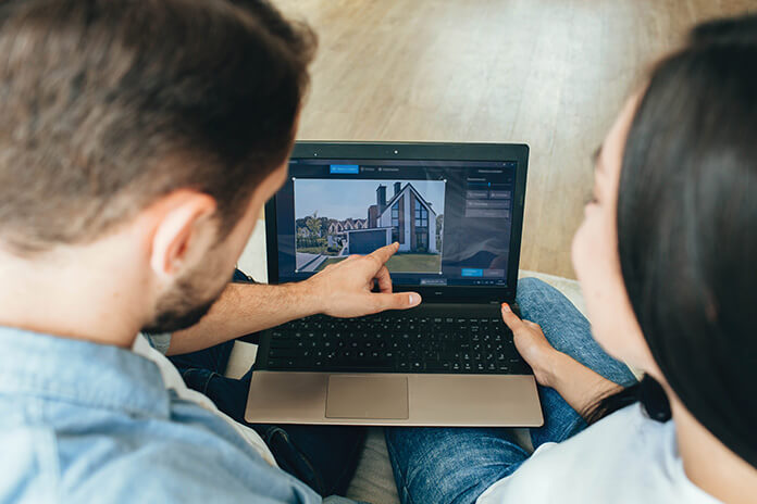 A couple searching for a property online