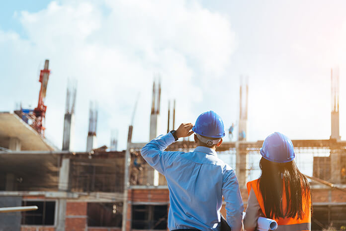 A man and woman on a construction site