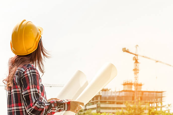 A female engineer overseeing the construction of a building